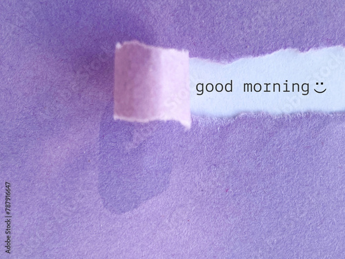 Quadro em tela Good morning text behind torn paper background. Stock photo.