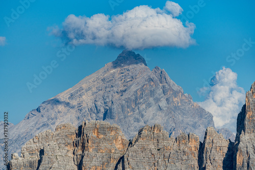 Cloud over single mountain peak in sunny day © Marcin Mucharski