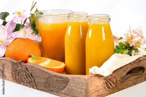 Orange juice in the glass bottles