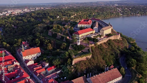 Observation of the Petrovaradin Fortress, a historic castle overlooking Novi Sad from a hill, showcasing its architecture and surroundings. photo