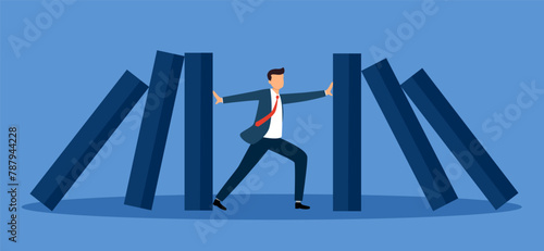Crisis management, leadership to manage disaster situation, challenge to overcome difficulty in economic crisis concept. Businessman use his hands to stop domino fall.