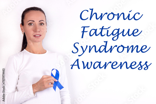 Doctor holding blue ribbon, closeup. Chronic Fatigue Syndrome awareness concept photo