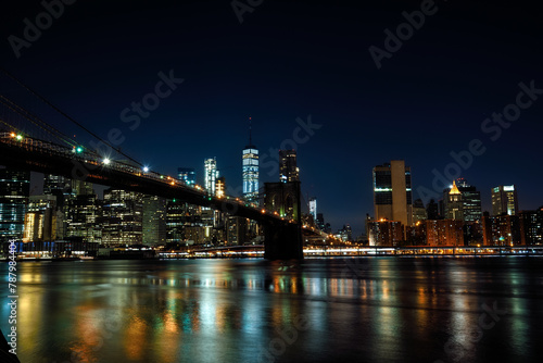 The Brooklyn Bridge and Manhattan Financial District seen from Brooklyn Bridge Park at Night - New York City