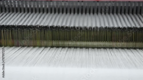 mechanism of the working loom in operation close-up, weaving, fabric making