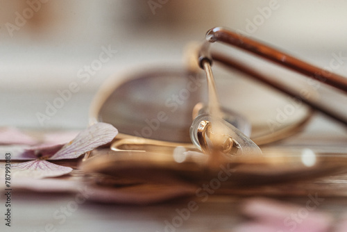Close-up of a pair of gold rimed aviator style sunglasses photo