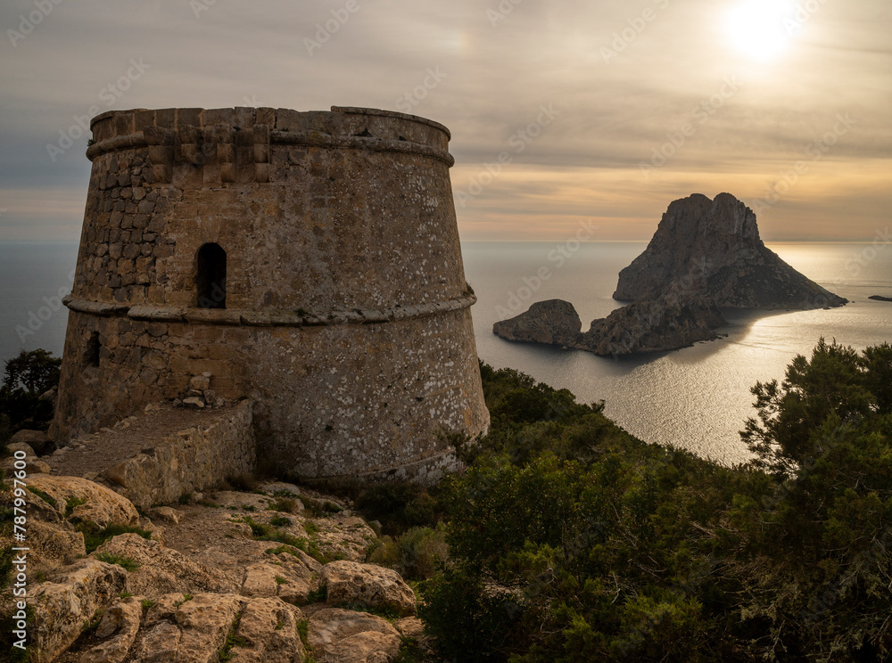 Torre des Savinar (Torre Pirata) and Es Vedra island at sunset, Cap des Jueu, Sant Josep de Sa Talaia, Ibiza, Balearic Islands, Spain Torre des Savinar (Torre Pirata) and Es Vedra island at sunset, Cap des Jueu, Sant Josep de Sa Talaia, Ibiza, Balearic Islands, Spain