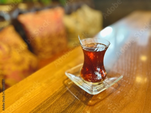 Close-up of a glass cup of traditional Turkish tea on a table