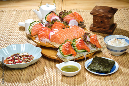 salmon sashimi raw fish freshness Asian japan food in the traditional wooden dish with natural wicker placemat