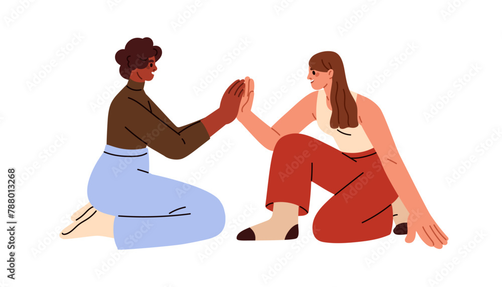 Naklejka premium Happy young women giving high five, gesturing. Girls friends playing clapping game, sitting on floor. Joyful communication, relationship. Flat vector illustration isolated on white background