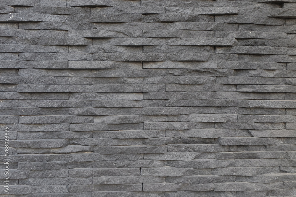 Neat abstract shapes and patterns of natural stone walls. Rectangular natural stone. House walls covered with natural stone for aesthetics. For graphic design and background Neat abstract shapes and patterns of natural stone walls. Rectangular natural stone. House walls covered with natural stone for aesthetics. For graphic design and background