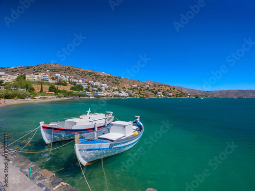 Boat mooring on an emerald green beach (Elounda, Crete, Greece)