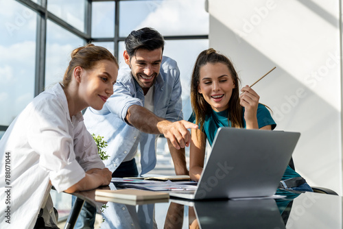 Group of happy businesspeople celebrate their successful project. Professional business team win and proud of their project at modern office. Successful teamwork, happy colleague, workplace. Tracery.