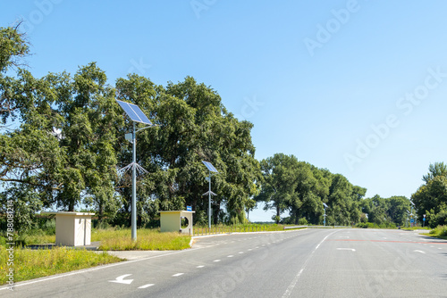 Asphalted highway. Lanterns with solar panels along the road.