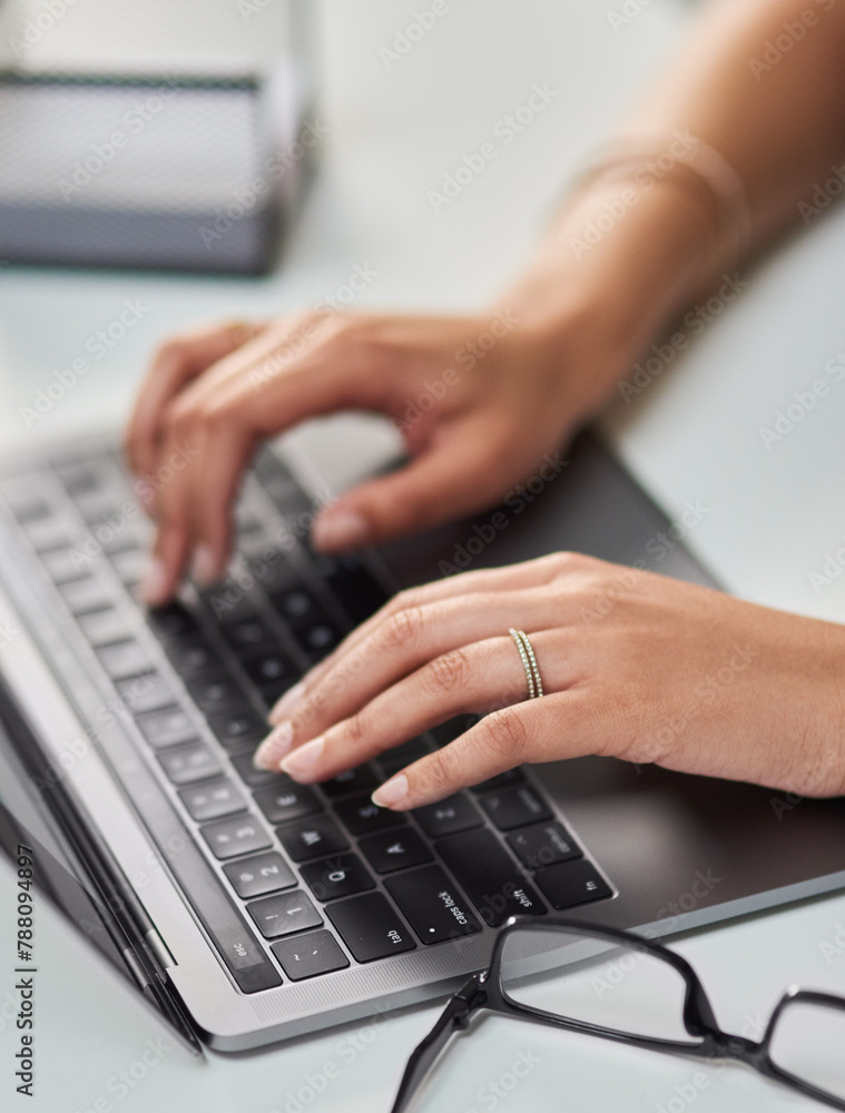 Typing, hands and laptop for administration, business or communication in office. Glasses, person or technology for web, connection and internet or contact and email for corporate job in above view Typing, hands and laptop for administration, business or communication in office. Glasses, person or technology for web, connection and internet or contact and email for corporate job in above view