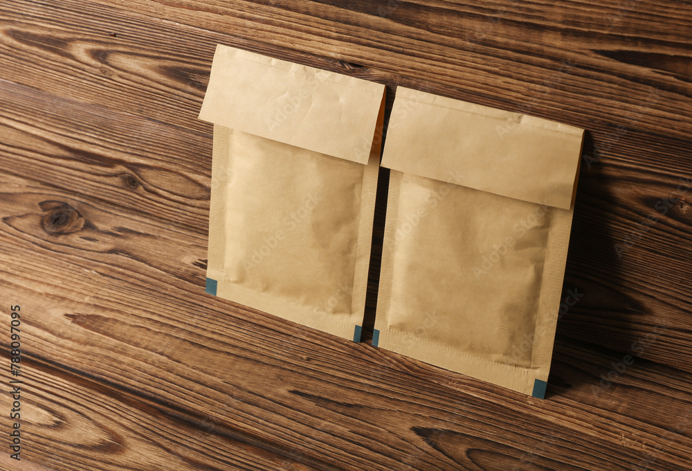 Fototapeta premium Shipping Post Parcel Envelopes on Wooden Background