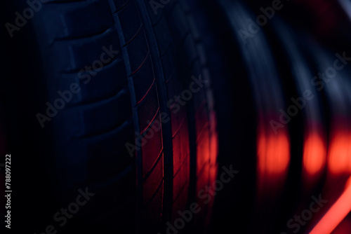 Car tires background picture lit with red light