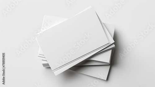 A stack white blank business cards isolated on white background © Yuwarin