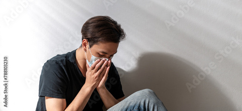 Fotografie asian man wear mask sad alone