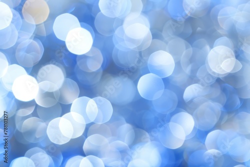 Abstract blue light bokeh background with blurred defocused effect for artistic design