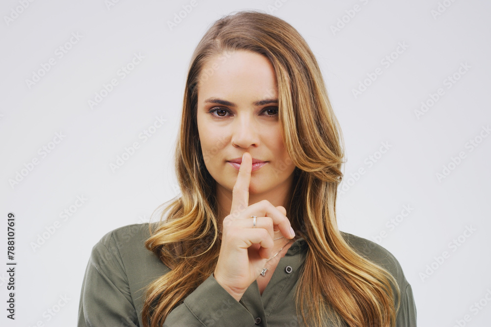 Model, portrait and finger with hush, studio and silence for mystery announcement. Woman, gossip and secret with rumor, whisper and gesture for news or noise with confidential on white background Model, portrait and finger with hush, studio and silence for mystery announcement. Woman, gossip and secret with rumor, whisper and gesture for news or noise with confidential on white background