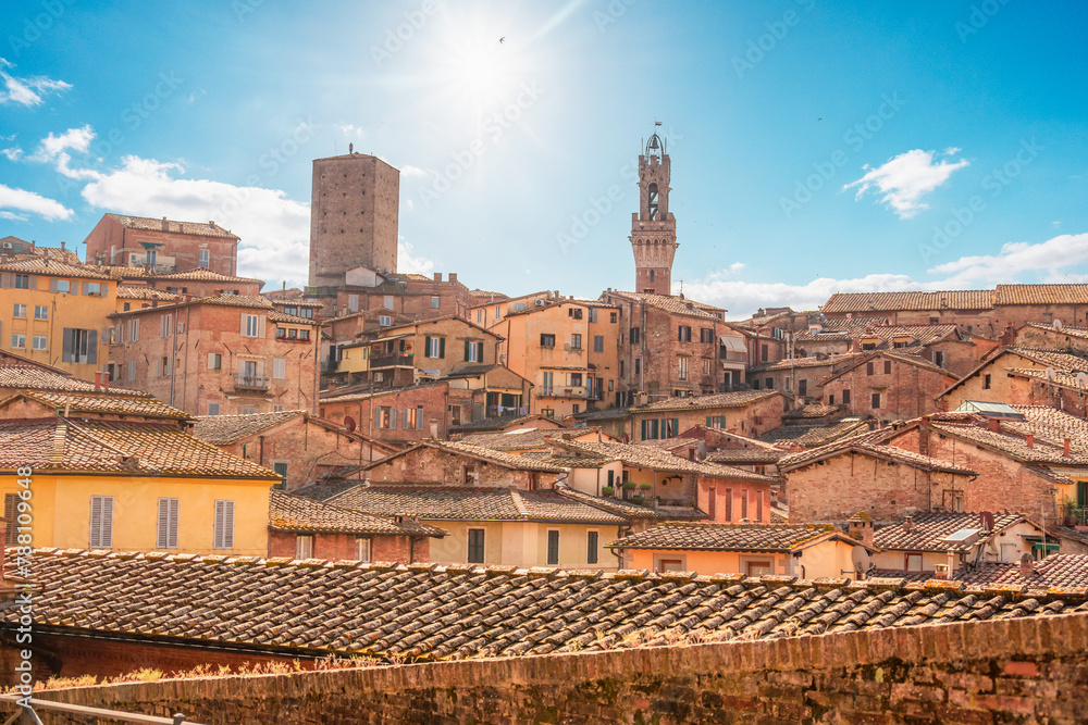 Siena, medieval town in Tuscany, with view of the Dome & Bell Tower of Siena Cathedral,  Mangia Tower and Basilica of San Domenico, Italy