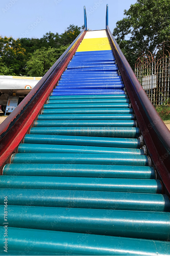 Colorful Rollers on Slide in Park