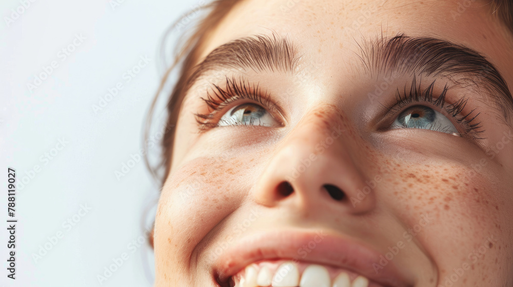 young woman face with looking eyes raised up to the sky and funny expression happy laughing pose isolated on white background young woman face with looking eyes raised up to the sky and funny expression happy laughing pose isolated on white background