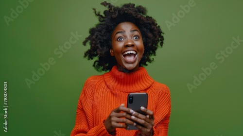 Woman Excited by Smartphone Message photo