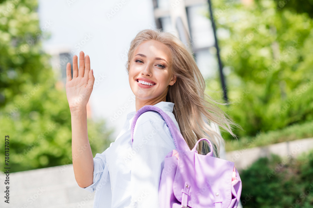 Photo of cute positive adorable girl walking on sunny day in green park waving arm hello good mood spring outside Photo of cute positive adorable girl walking on sunny day in green park waving arm hello good mood spring outside