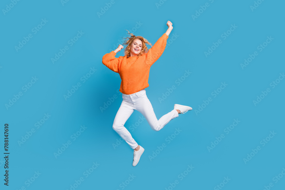 Photo of overjoyed nice pretty woman wear trendy orange clothes good mood isolated on blue color background Photo of overjoyed nice pretty woman wear trendy orange clothes good mood isolated on blue color background