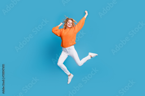 Photo of overjoyed nice pretty woman wear trendy orange clothes good mood isolated on blue color background