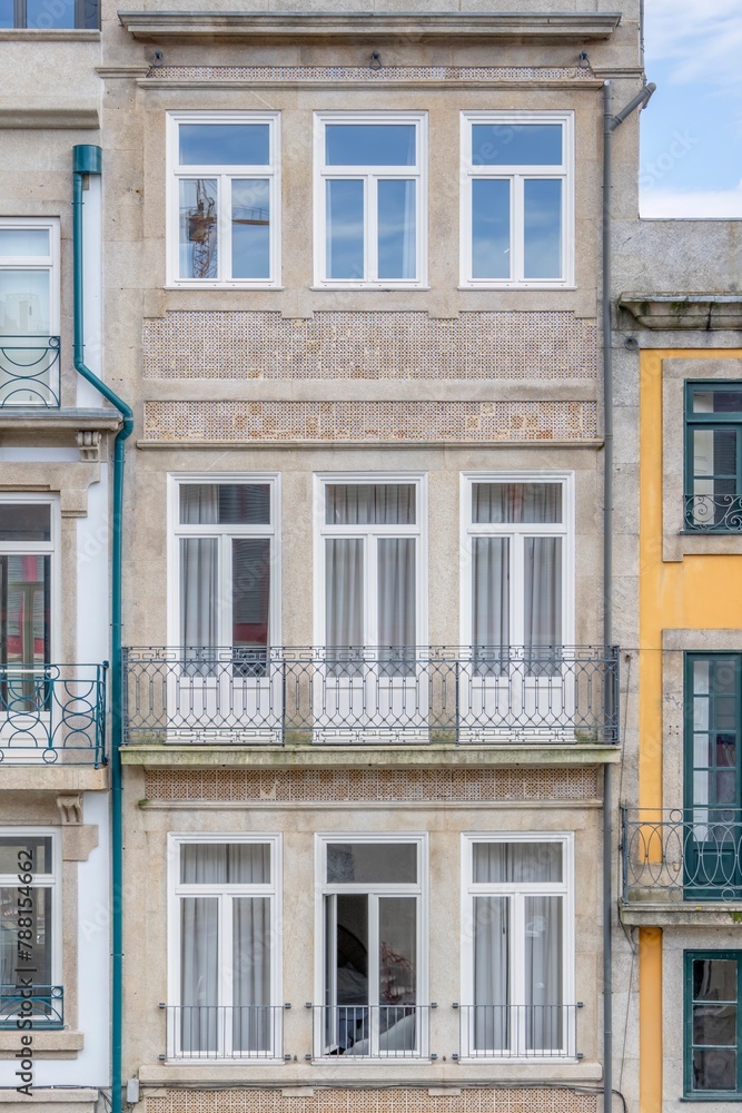Front view of a typical building of the city of Porto. Typical facade of the buildings of the beautiful city of Porto, travel and monuments of Portugal. Next to the Douro river.