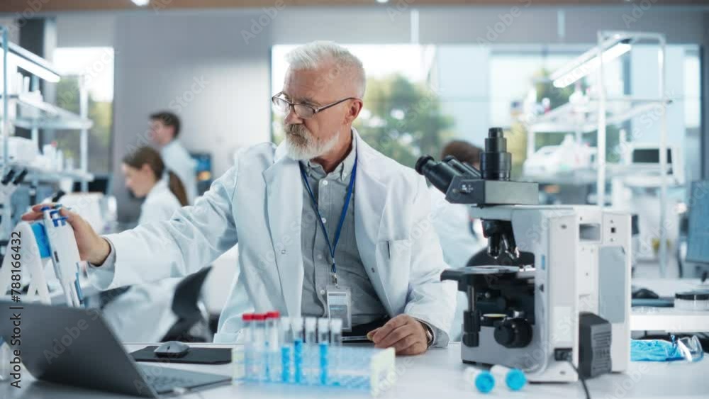 Medical Research and Development Laboratory: Senior Caucasian Male Scientist in Glasses Looking at a Sample in a Petri Dish Under a Microscope in an Advanced Biotechnology Lab Medical Research and Development Laboratory: Senior Caucasian Male Scientist in Glasses Looking at a Sample in a Petri Dish Under a Microscope in an Advanced Biotechnology Lab