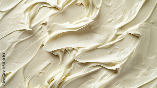 A detailed top-view photograph captures the luscious texture and richness of cream, highlighting its intricate details. This close-up image invites viewers to appreciate the smoothness and indulgence 