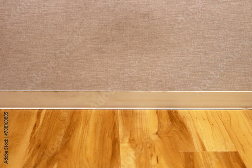 Wooden floor and wall with skirting boards