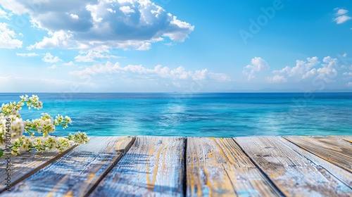 A conceptual summer setting on a wooden surface with a background of blue water photo