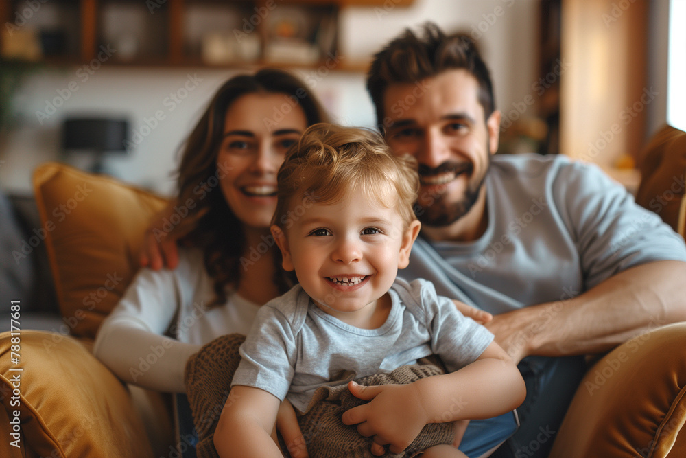 Man, Woman, and Child Sitting on a Couch Man, Woman, and Child Sitting on a Couch