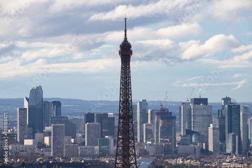 PARIS, FRANCE - MARCH 30, 2024: Eiffel Tower and La Defense business district seen from Montparnasse Tower