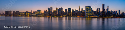 View of modern skyline at sunset, Manhattan, New York, United States. photo