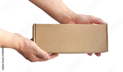 One rectangular cardboard box in hands on a plain light background. No recognizable people photo