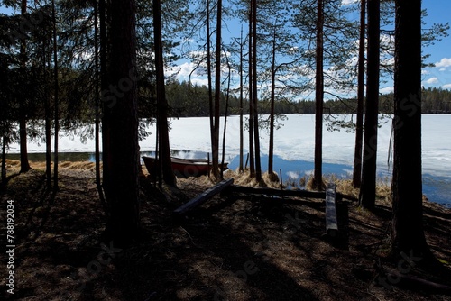 Campsite at Kirkasvetinen lake in spring, Hossa National Park, Suomussalmi, Finland. photo