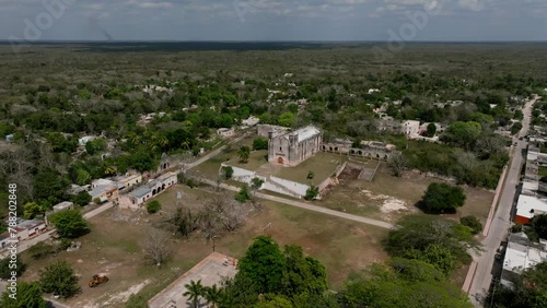 Aerial view of village with church, trees, and buildings in Sotuta, Yucatan, Mexico. photo