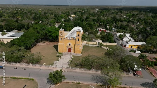 Aerial view of colonial church and town with tropical greenery, Sotuta, Yucatan, Mexico. photo
