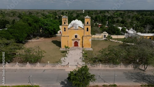 Aerial view of colonial town with catholic church and lush greenery, sotuta, yucatan, mexico. photo