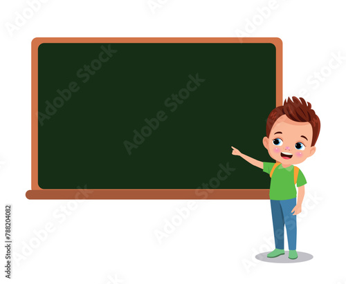 cute boy pointing at the classroom board