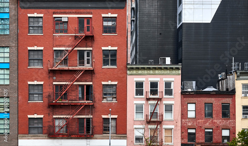 Old tenement houses with fire escapes in New York. photo