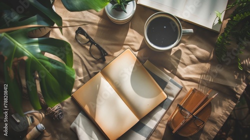 flat lay, everyday things / things you need in the office or in your free time like cup of coffee, glasses, pencils, notebook, book, ear phones ect., copy and text space, 16:9 photo