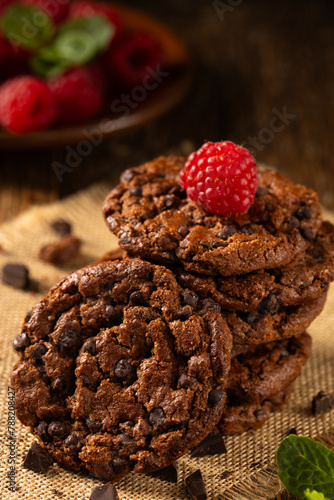 Delicious, shortcrust chocolate cookies with chocolate pieces. photo