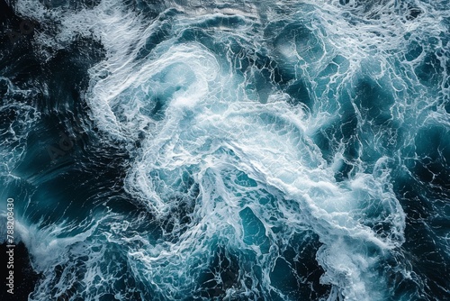 This aerial photograph provides a clear view of a large body of water and its surrounding landscape, Areal view of swirling ocean waves in a deep blue sea, AI Generated