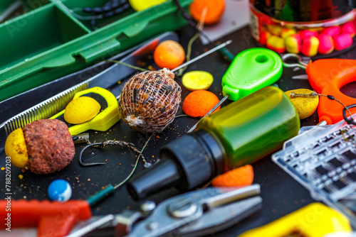 Carpfishing session at the Lake.fishing tools, scissors, carp bait,mixed in dips and stickbaits.Carp fishing rig.The Boilies with fishing hook.
